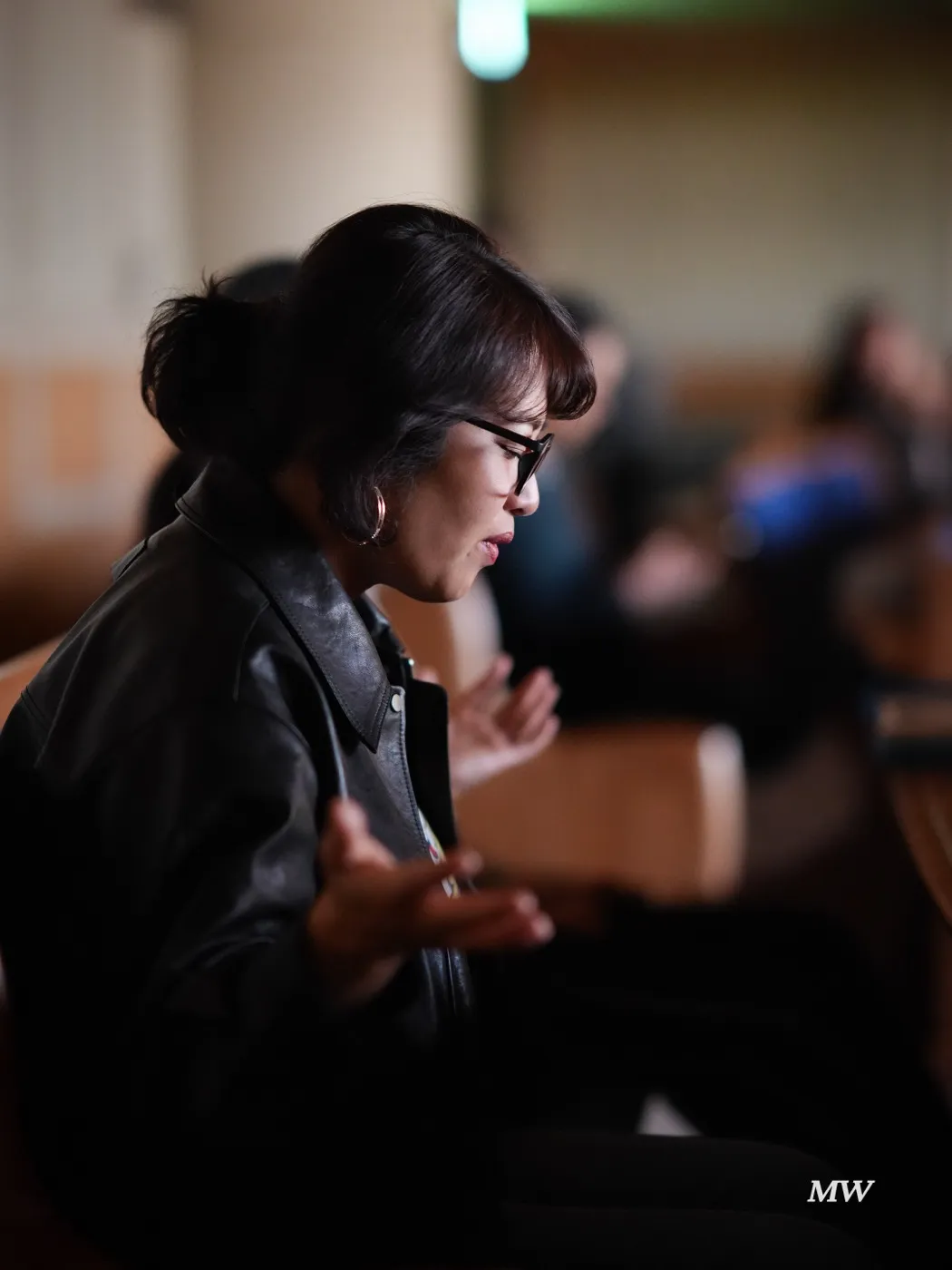 A worshiper praying with open hands and closed eyes